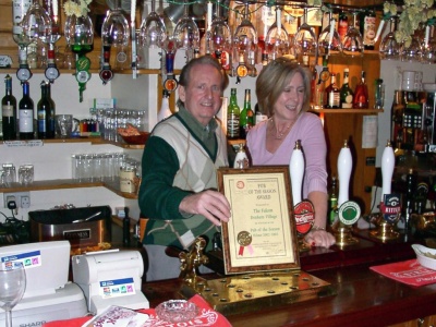 The Falcon Inn - Denham - Mine hosts receiving a Pub of the Year award